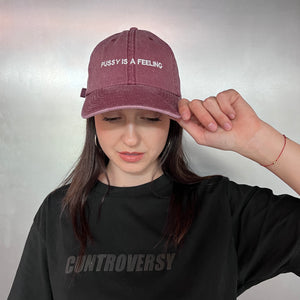 PUSSY IS A FEELING WASHED BURGUNDY DAD CAP
