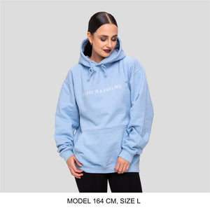 Baby blue hoodie with white PUSSY IS A FEELING embroidery designed by Identities Brand.
