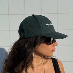 PUSSY IS A FEELING DARK GREEN WITH WHITE CAP