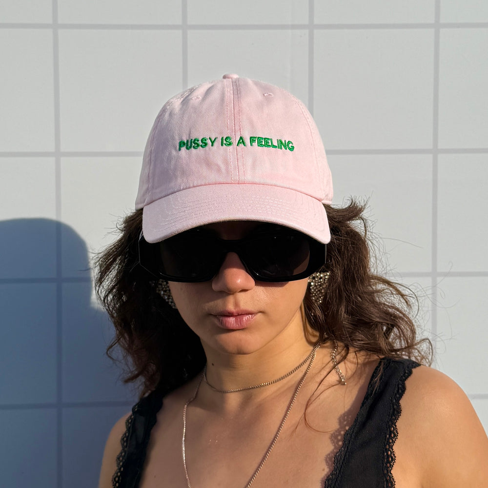 PUSSY IS A FEELING BABY PINK WITH GREEN SIGN DAD CAP
