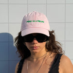 PUSSY IS A FEELING BABY PINK WITH GREEN SIGN DAD CAP