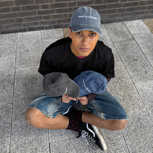 PUSSY IS A FEELING WASHED BLACK DAD CAP