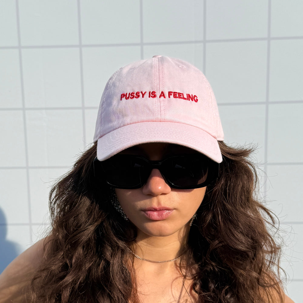 PUSSY IS A FEELING BABY PINK WITH RED SIGN DAD CAP