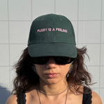 PUSSY IS A FEELING DARK GREEN WITH PINK CAP