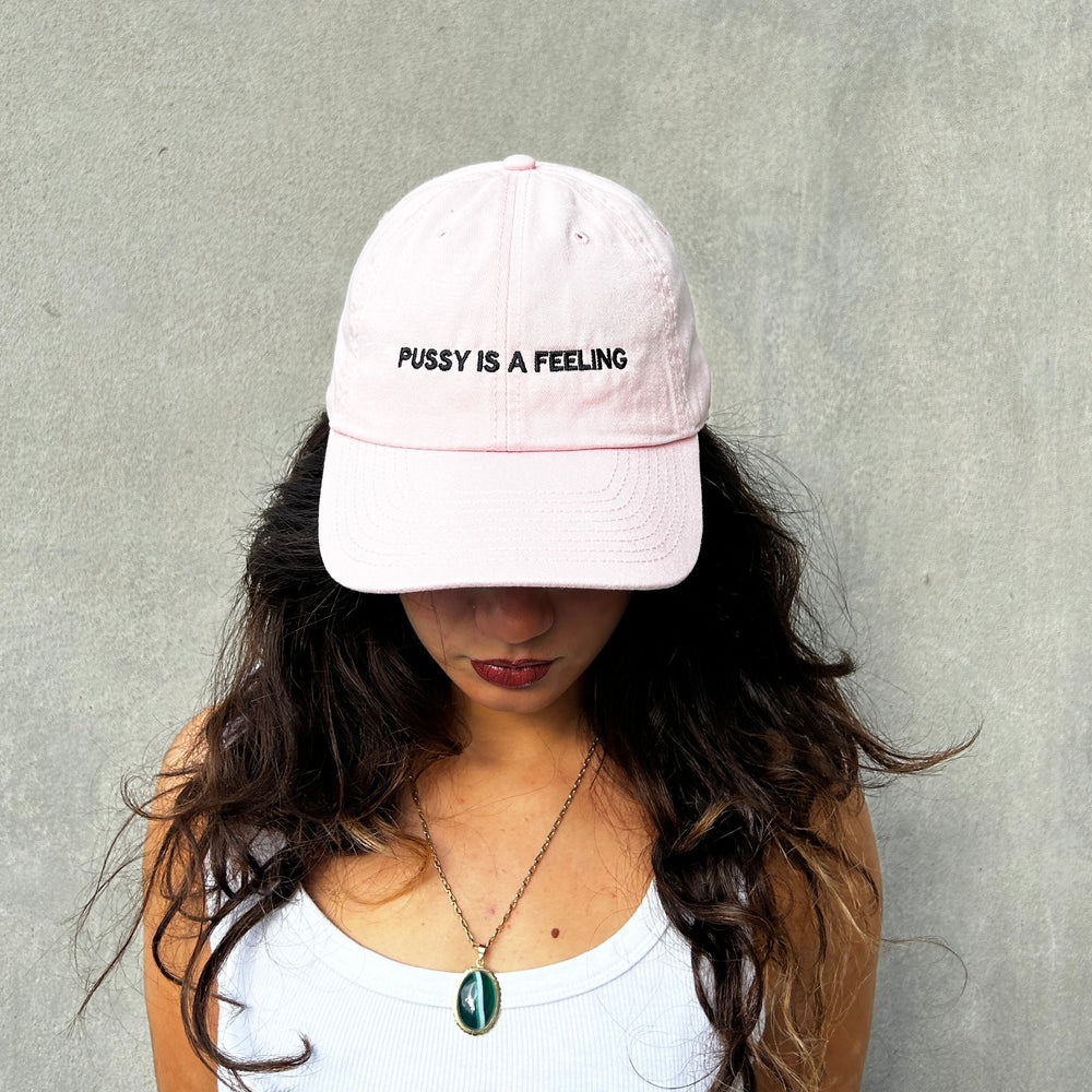 PUSSY IS A FEELING BABY PINK WITH BLACK SIGN DAD CAP