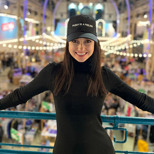 PUSSY IS A FEELING BEIGE CAP WITH BLACK SIGN