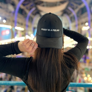 PUSSY IS A FEELING BEIGE CAP WITH BLACK SIGN