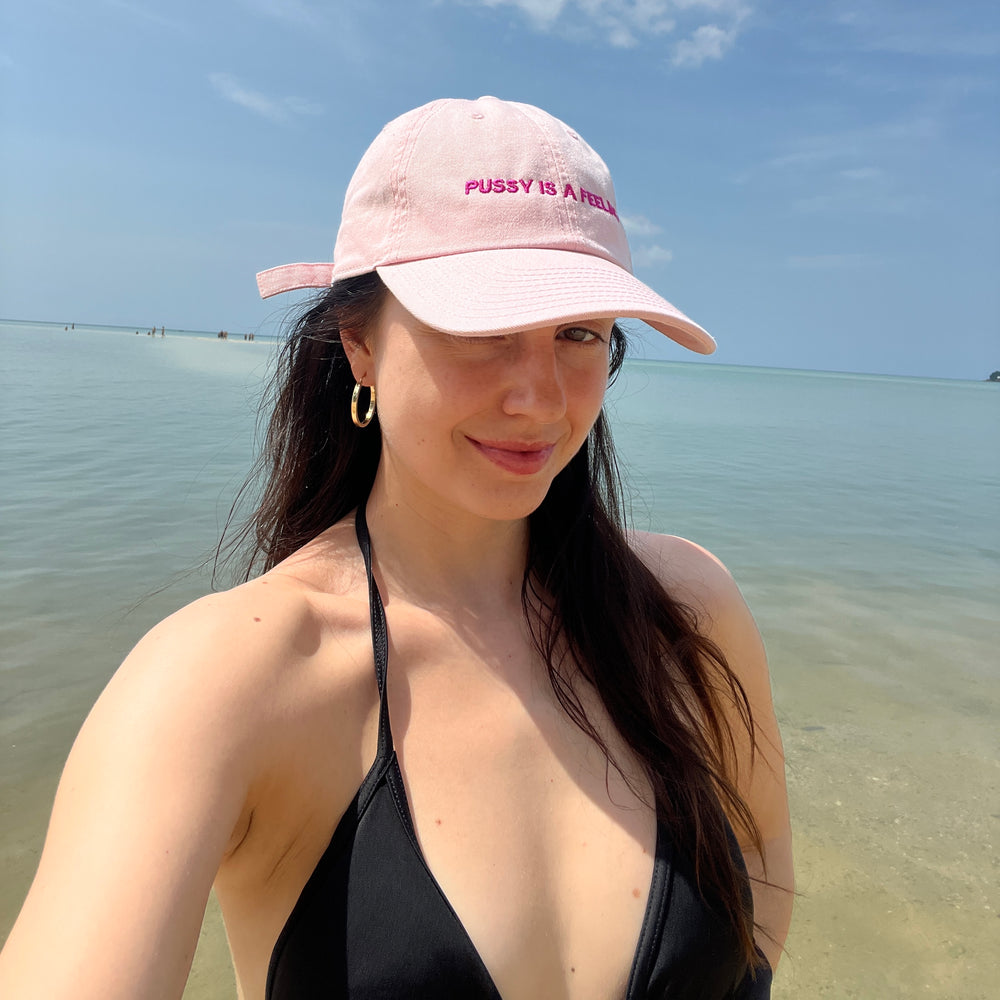 PUSSY IS A FEELING BABY PINK WITH MAGENTA SIGN DAD CAP