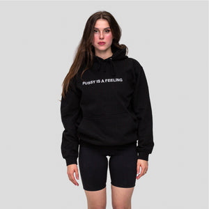 Black hoodie with white PUSSY IS A FEELING embroidery designed by Identities Brand.