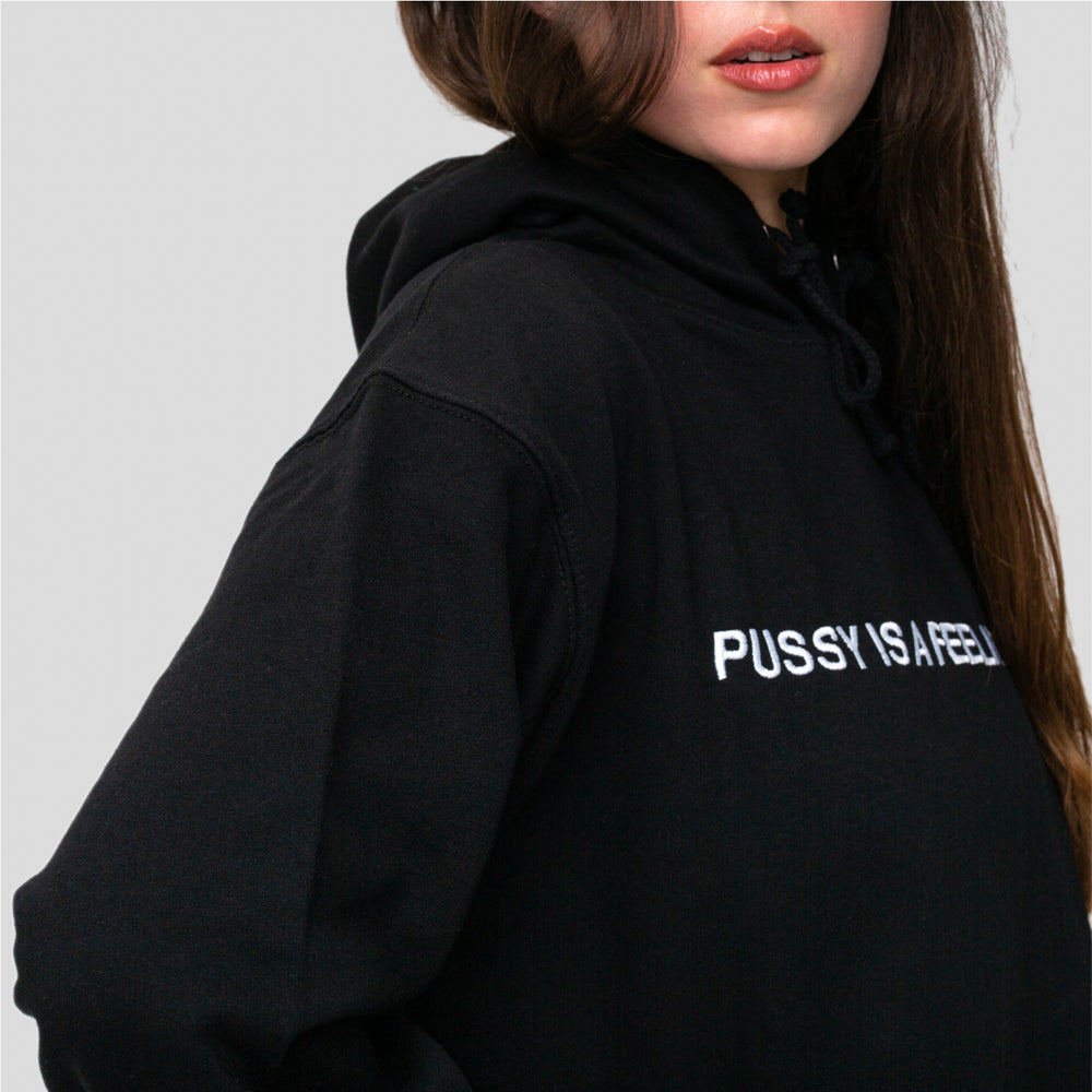 Black hoodie with white PUSSY IS A FEELING embroidery designed by Identities Brand.