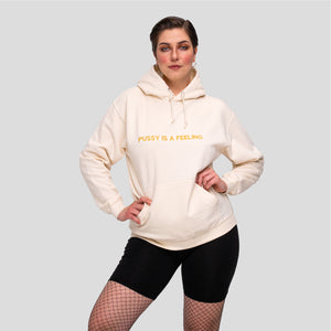 Vanilla hoodie with golden PUSSY IS A FEELING embroidery designed by Identities Brand.