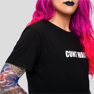 Black short-sleeved T-shirt with lilac CUNT WAIT print designed by Identities Brand.